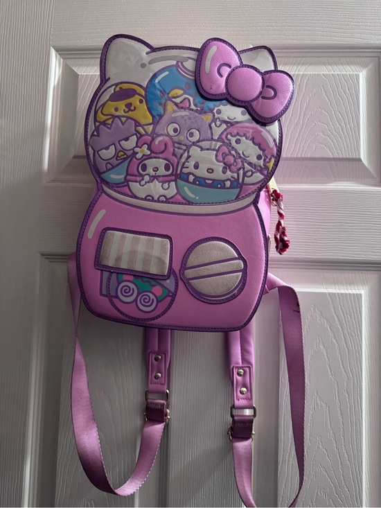 hello kitty gumball backpack and Friends x Loungefly Machine Mini This Hello Kitty mini backpack is officially licensed Hello Kitty merch by Loungefly and features a super cute design Kawaii Hello Kitty Gumball Machine